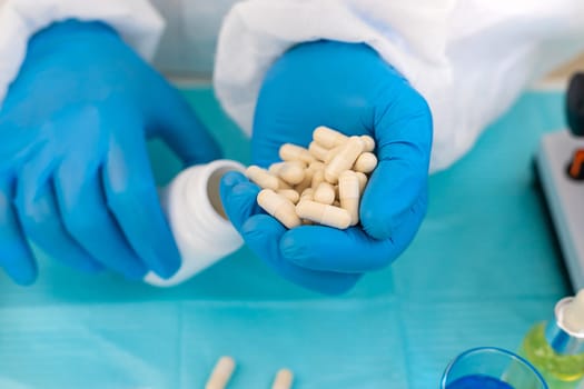 medicines in the hands of a doctor. Selective focus. pills.