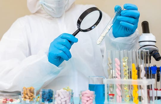 examine drugs in the laboratory. Selective focus. pills.