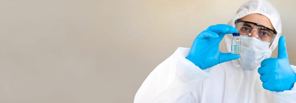 Medicine in a bottle in the hands of a doctor. Selective focus. vaccine