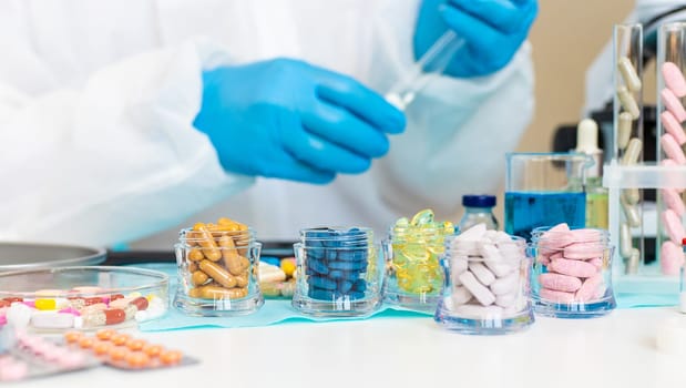 examine drugs in the laboratory. Selective focus. pills.