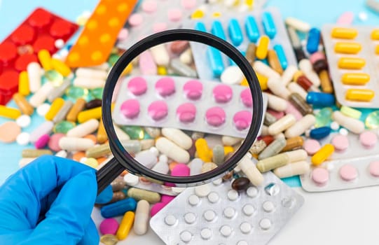 examine drugs in the laboratory. Selective focus. pills.