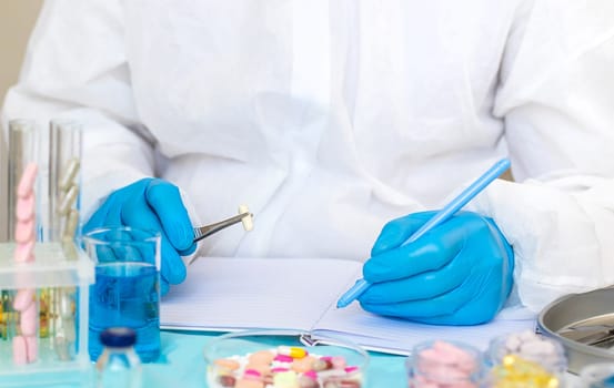 examine drugs in the laboratory. Selective focus. pills.