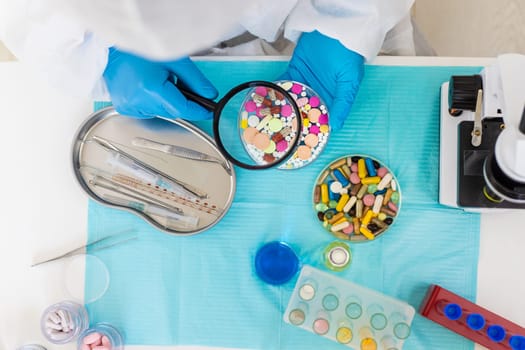 examine drugs in the laboratory. Selective focus. pills.