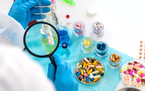 examine drugs in the laboratory. Selective focus. pills.