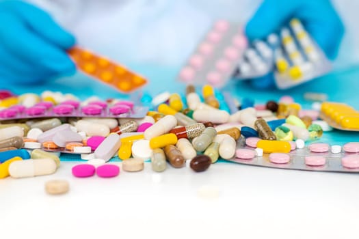 medicines in the hands of a doctor. Selective focus. pills.
