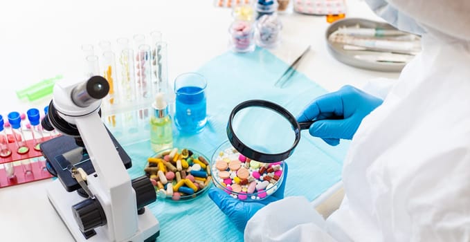 examine drugs in the laboratory. Selective focus. pills.