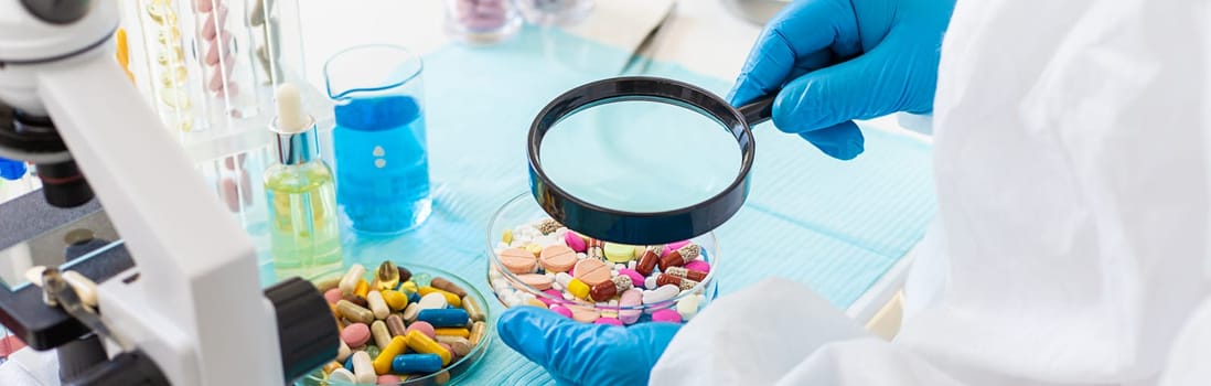 examine drugs in the laboratory. Selective focus. pills.