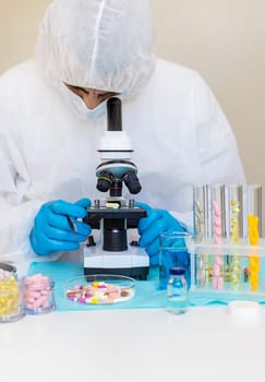examine drugs in the laboratory. Selective focus. pills.