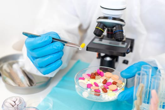 examine drugs in the laboratory. Selective focus. pills.