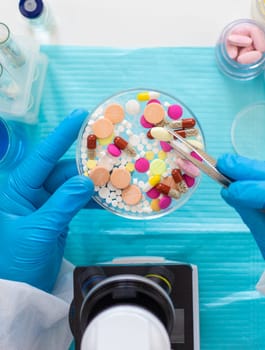 examine drugs in the laboratory. Selective focus. pills.