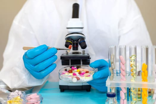 examine drugs in the laboratory. Selective focus. pills.