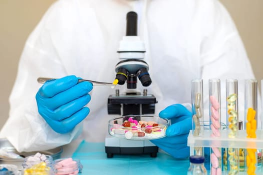 examine drugs in the laboratory. Selective focus. pills.