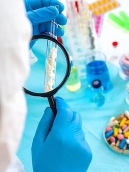 examine drugs in the laboratory. Selective focus. pills.