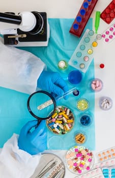 examine drugs in the laboratory. Selective focus. pills.
