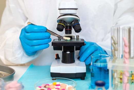 examine drugs in the laboratory. Selective focus. pills.