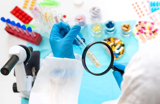 examine drugs in the laboratory. Selective focus. pills.