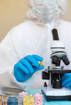 examine drugs in the laboratory. Selective focus. pills.