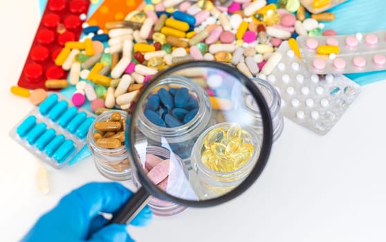 examine drugs in the laboratory. Selective focus. pills.