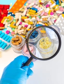examine drugs in the laboratory. Selective focus. pills.
