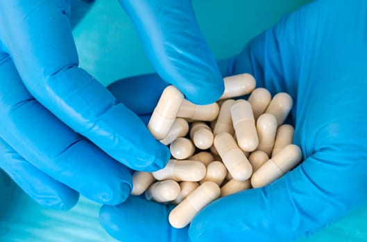medicines in the hands of a doctor. Selective focus. pills.