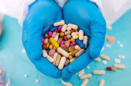 medicines in the hands of a doctor. Selective focus. pills.