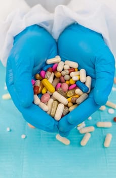 medicines in the hands of a doctor. Selective focus. pills.