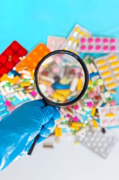 examine drugs in the laboratory. Selective focus. pills.
