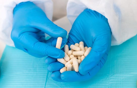 medicines in the hands of a doctor. Selective focus. pills.