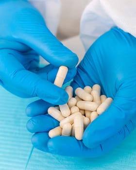 medicines in the hands of a doctor. Selective focus. pills.