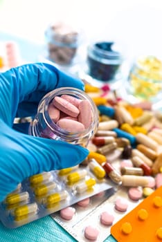 medicines in the hands of a doctor. Selective focus. pills.