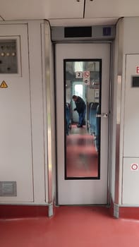 October 21 2024 Stara Paka, Czech Republic Train corridor reflection street, railway station, building, transport, movement, sign. High quality photo