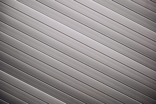 Gray cladding forming diagonal lines creating modern background for various projects