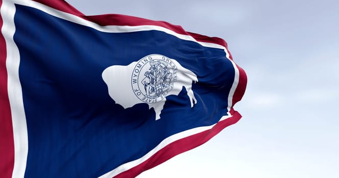 3D render of the Wyoming state flag featuring the bison and state seal, fluttering in the wind and symbolizing pride, identity, and freedom in the United States.