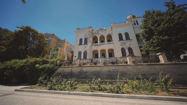 Crumbling mansion showing signs of neglect and disrepair in Crimea, evoking a sense of forgotten grandeur
