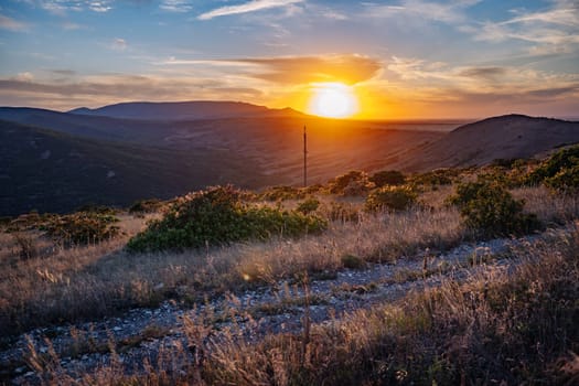 Scenic view of Crimean landscape at sunset with mountains, valleys, and colorful sky