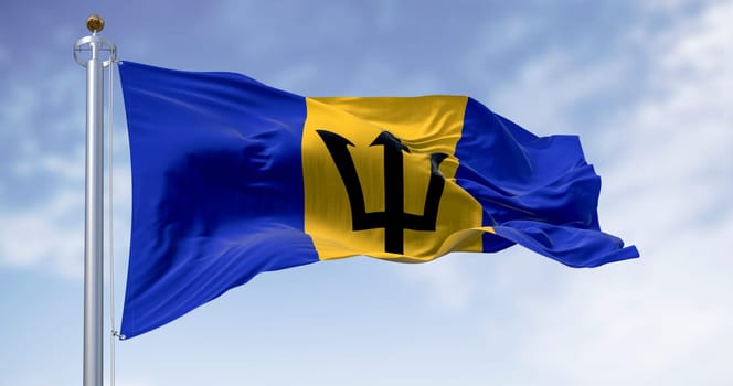 3D render of Barbados flag with the Broken Trident, a national symbol of pride, independence, and Caribbean identity. Blue sky and realistic fabric motion.