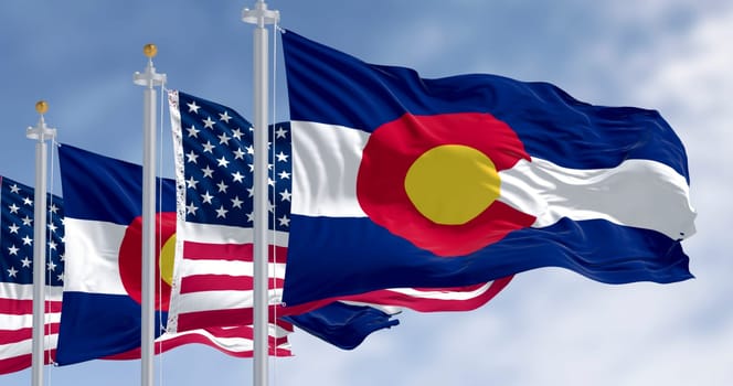 3D render of Colorado state flag and American flag waving in the wind, symbolizing patriotism, identity, and unity across the USA. Clear sky background