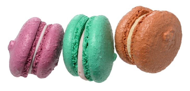 Macarons with a creamy white filling, isolated background. The macaron has a smooth, porous shell