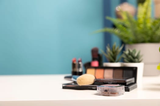 A minimalist beauty workspace with carefully placed skincare and makeup essentials, complemented by small plants. Ideal for digital marketing, online stores, and social media branding.
