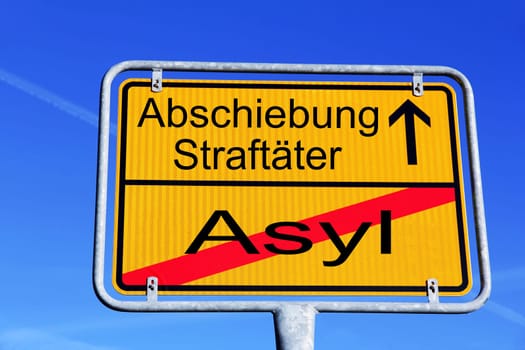 German street sign with the inscription Asylum and deportation offender