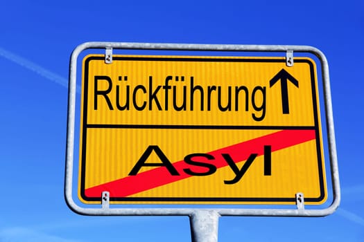 German street sign with the inscription Asylum and repatriation