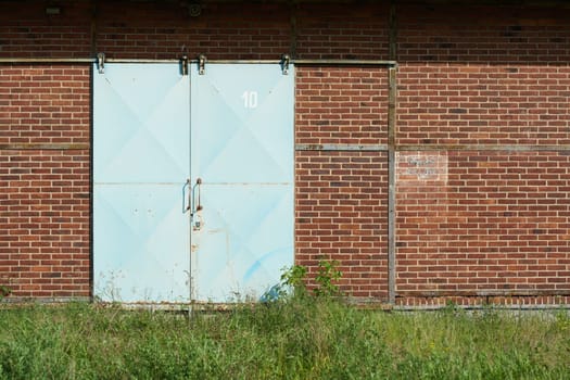blue metal gate to a warehouse in the port of Magdeburg, Germany