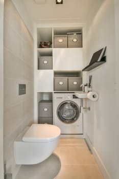 a small bathroom with a washer and dryer in the corner, which can be used as a laundry room
