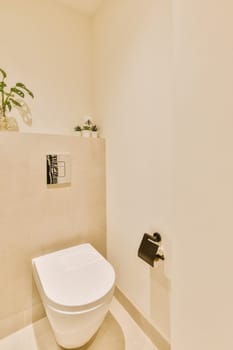 a bathroom with a toilet and plant on the wall next to the toilet in the photo is taken from above