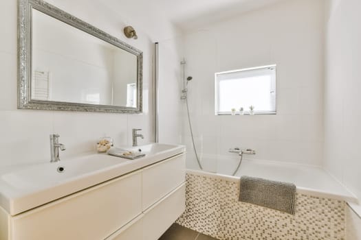 a bathroom with a sink, mirror and bathtub in the same color as it appears on the wallpaper