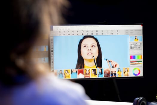 Photographer using software on computer to perform editing operations, correcting images in creative agency. Photo editor using desktop PC to make adjustments to photographs, close up