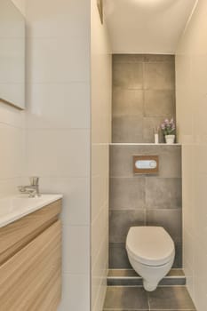a bathroom with a toilet in the corner and a sink on the other side next to the wall is a mirror