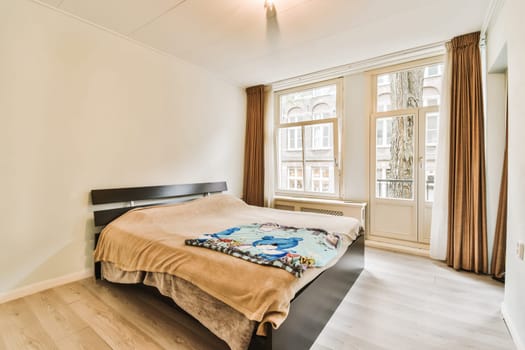 a bedroom with wood flooring and large window overlooking the cityscapearn comonlycome