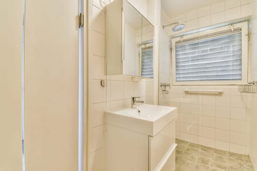 a small bathroom with a sink and mirror on the wall next to the shower stall in the room is very clean
