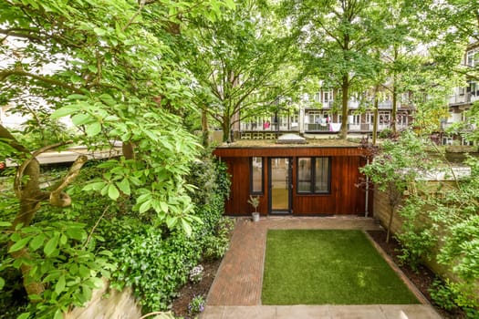 a garden with trees and plants in the fore - image courtesy from real estate agent's facebook page / real estate